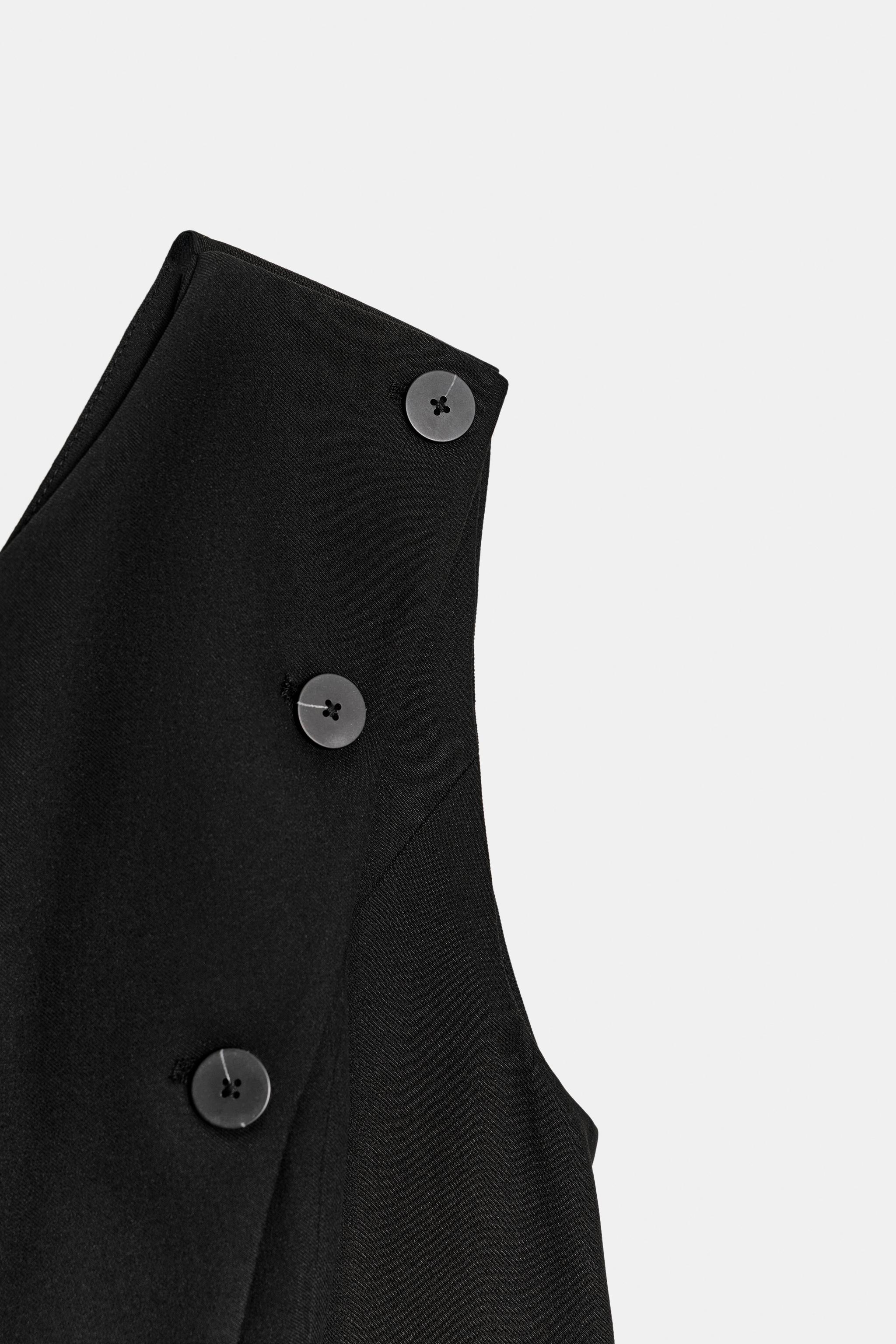 GILET ASYMÉTRIQUE À BOUTONS
